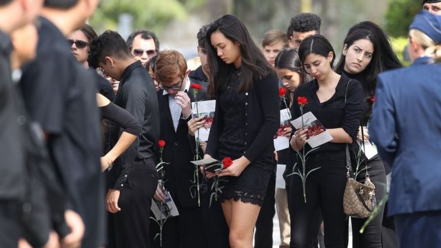 Mourners attend the funeral of Peter Wang, 15, on 20 February 2018 in Coral Springs, Florida