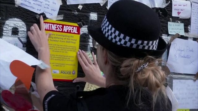 Police officer sticks witness appeal to mural