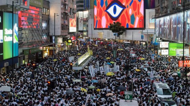 Thousands of protesters take part in a march against amendments to an extradition bill in Hong Kong