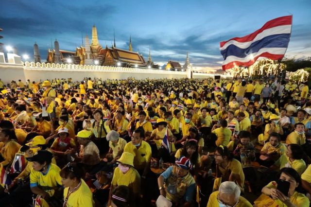 People dressed in yellow shirts were waiting to greet him.