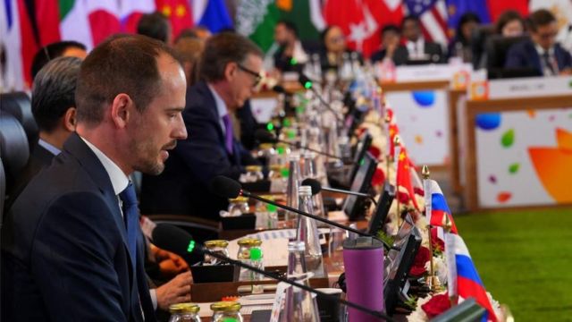 A Russian delegate sits at a long table of G20 finance ministers and central bank governors at a meeting in Bangalore, India.