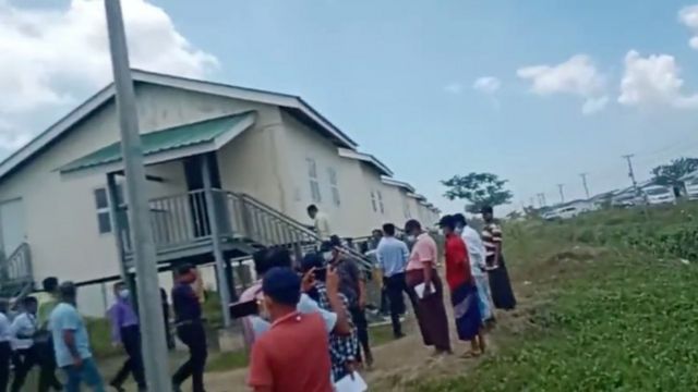 Rohingya refugees being shown the new accommodation