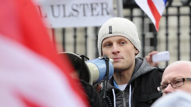 Jamie Bryson addressing protesters at a demonstration at Belfast City Hall in 2013