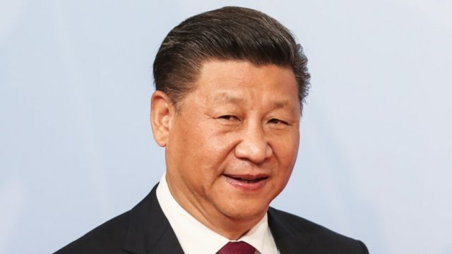 Chinese President Xi Jinping arrives for a family photo during the G20 summit on 7 July 2017 in Hamburg, Germany.