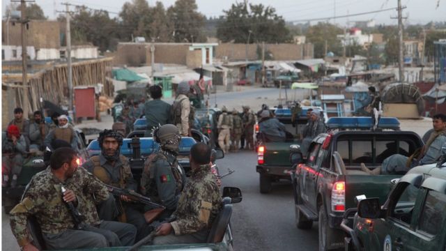 Afghan security forces in pick-up trucks during a counter-offensive to regain control of Kunduz
