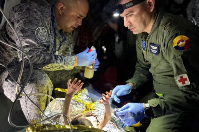 Soldiers of the Colombian Air Force give medical attention inside a plane to the surviving children of a Cessna 206 plane crash in the thick jungle, while they are transferred to Bogota by air in San Jose del Guaviare, Colombia, June 9, 2023. Colombian Air Force/Handout via REUTERS