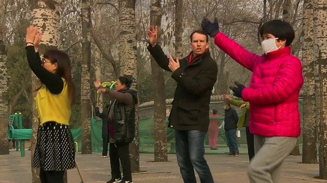 John Sudworth dancing with two Chinese women