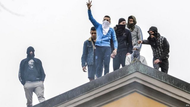 Detainees protest on the roof of the San Vittore prison in Milan, northern Italy, 9 March 2020