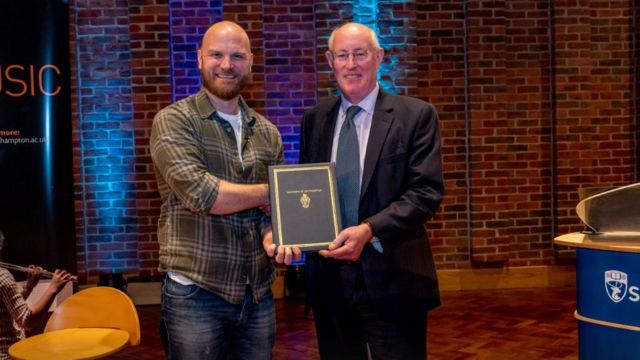 Coldplay drummer meets students and receives honorary degree