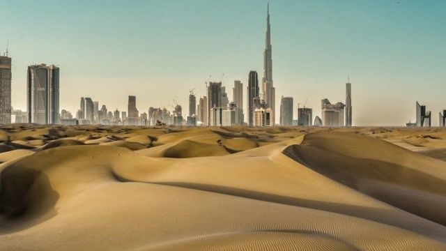 Tall buildings in Dubai surrounded by deserts