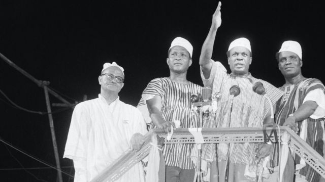 Kwame Nkrumah (center) waves to the crowd during the 6 March 1957 declaration of Ghana as an independent state from the British colony