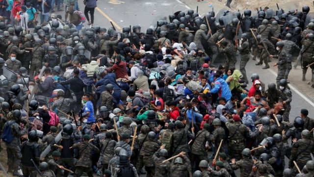 Hondurans taking part in a new caravan of migrants set head to the United States, clash with Guatemalan soldiers as they try to cross into Guatemalan territory, in Vado Hondo, Guatemala