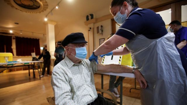 A man receives a vaccine against the coronavirus disease (COVID-19) in the Winding Wheel Theatre, Chesterfield, Britain