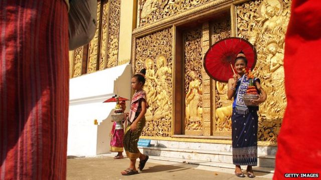 Girls in traditional Laotian costume during Songkran New Year celebrations at the Wat Xieng Thong temple in the former Laotian capital Luang Prabang