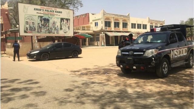 Police vehicles tanda for di entrance of di Emir palace for Kano