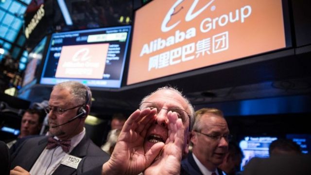 Traders work on the floor of the New York Stock Exchange while the price of Alibaba Group's initial price offering (IPO) is decided on September 19, 2014 in New York City
