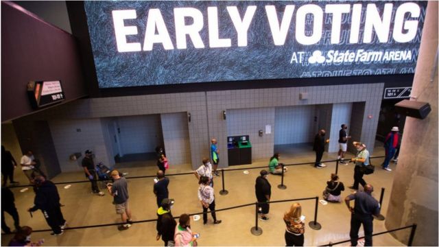 Voters in Atlanta queue to vote in an NBA arena