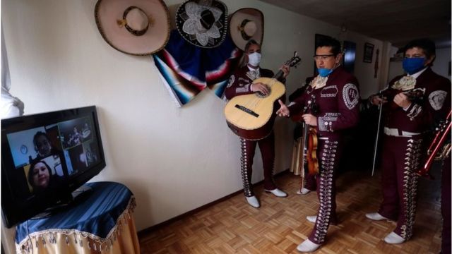 A group of folk musicians in Ecuador play for a virtual audience using Zoom