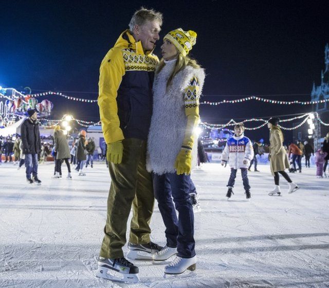 Olympic figure skating champion and TV presenter Tatiana Navka, right, and Presidential spokesman Dmitry Peskov pose at the opening of a skating rink in Red Square on November 28, 2015.