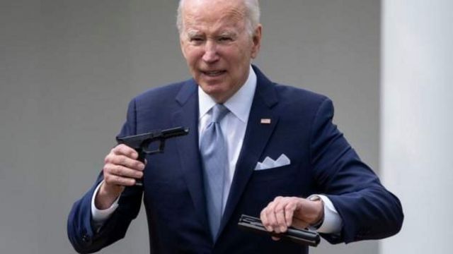 Joe Biden shows the elements of a "Ghost gun" At an event at the White House in April.