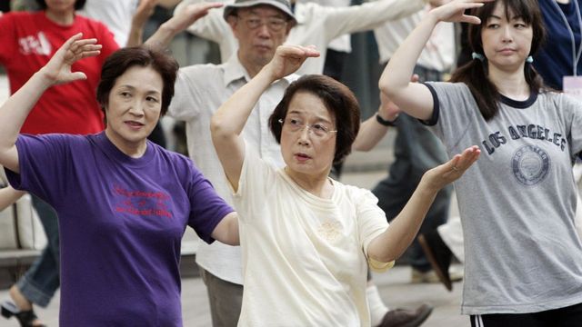 A group of Japanese people practicing tai chi