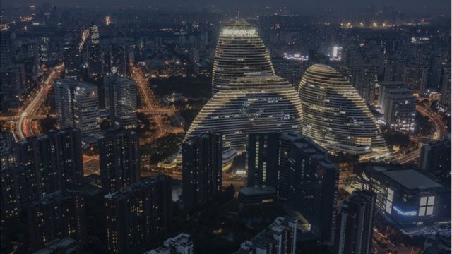The Wangjing SOHO development is illuminated at night on October 6, 2020 in Beijing, China.