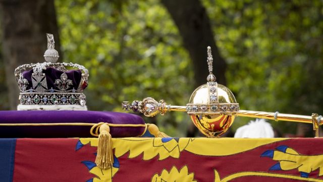 The State Imperial Crown, Royal Orb, and Scepter depicted atop the late Queen's coffin will be used during the coronation ceremony