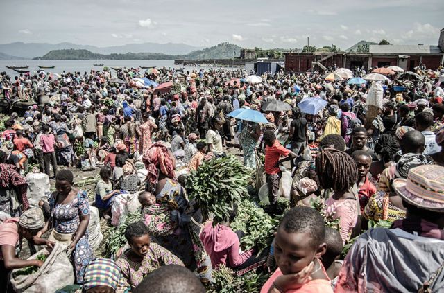 Vendors and shoppers at Kituku market on the shores of Lake Kivu