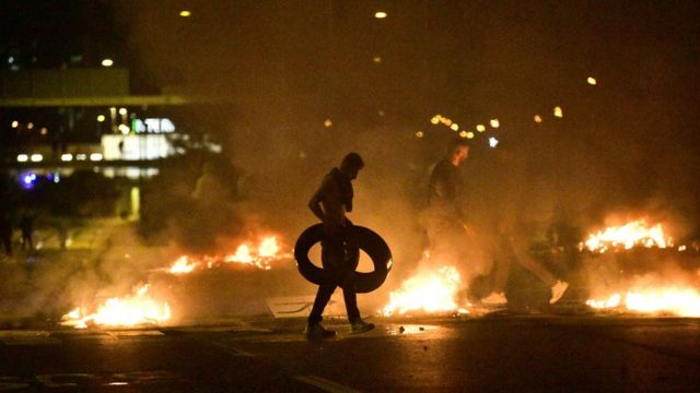 Demonstrators burn tyres as protesters riot in the Rosengard neighbourhood of Malmo, Sweden, on 28 August 2020.