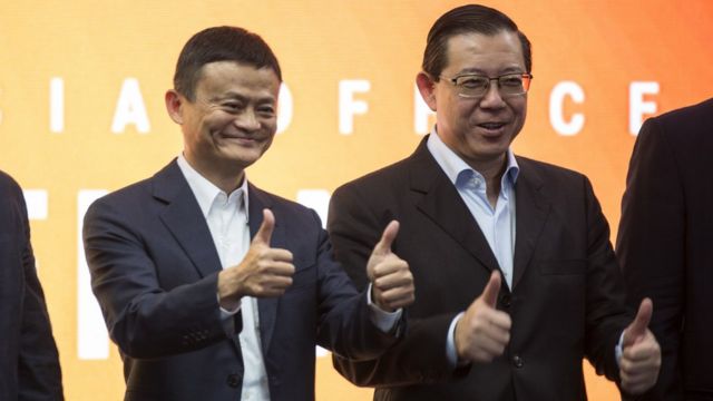 Jack Ma (L), the founder and executive chairman of Chinese e-commerce company Alibaba Group with Malaysian Fnance Minister, Lim Guan Eng (R) give the thumbs up during the opening of the Alibaba group office in Kuala Lumpur, Malaysia, 18 June 2018.