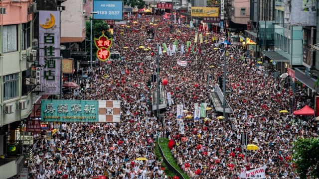 Thousands of protesters take part in a march against amendments to an extradition bill in Hong Kong