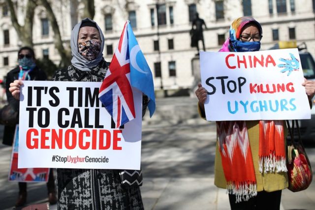 Uyghurs during a demonstration in Parliament Square, London Thursday April 22, 2021