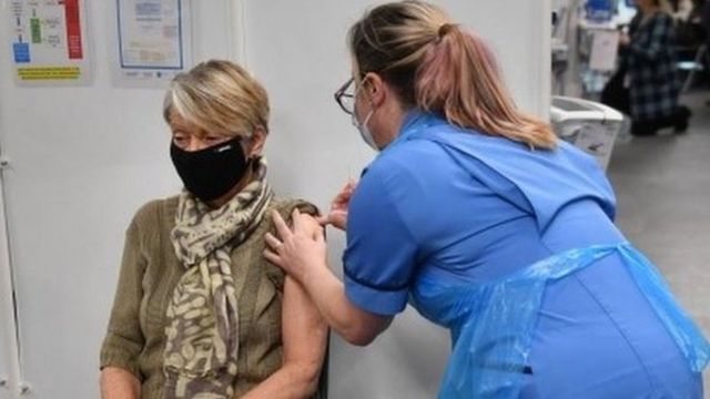 Rita Passey receives an injection of a Covid-19 vaccine in Birmingham