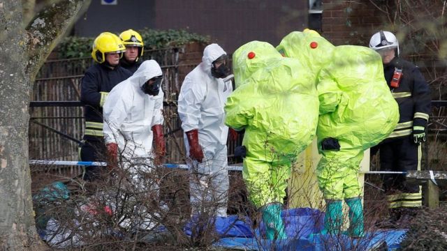 Officials in protective suits examine the area where Mr Skripal and his daughter were found