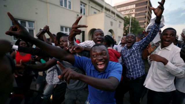 Men celebrate in Harare