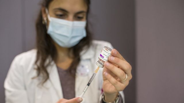 A doctor prepares the dose of AstraZeneca vaccine on March 19, 2021 in Bologna, Italy. The European Medicines Agency, the EU's health regulator, encouraged countries to resume use of the AstraZeneca covid-19 vaccine after finding there was no evidence it caused blood clots.