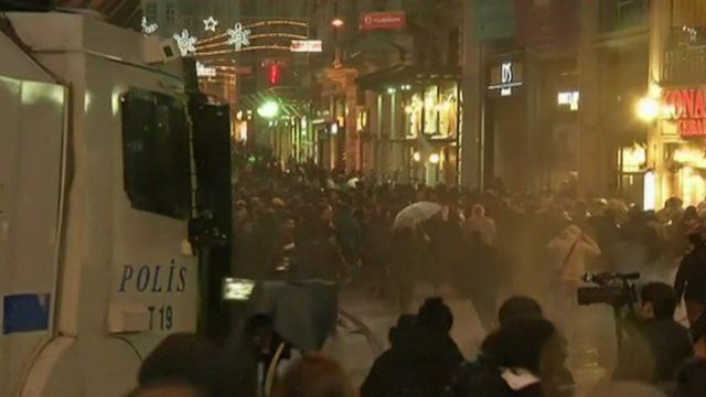 Water cannon advancing towards protesters