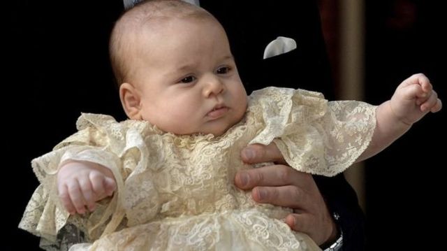 23 October 2013: Prince George is held by his father on his christening day, as they arrive at the Chapel Royal in St James's Palace in London