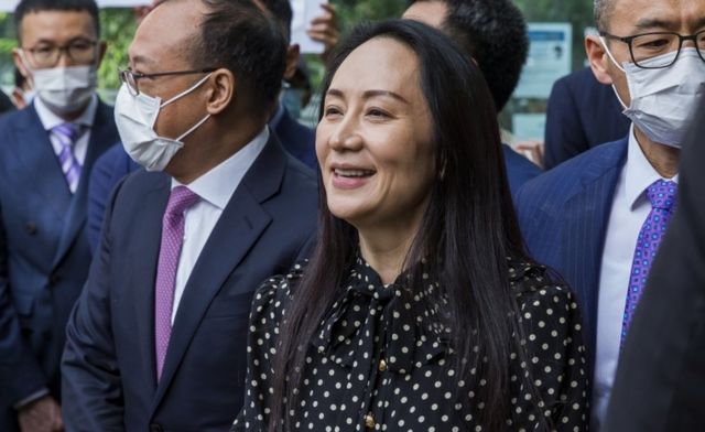 Meng Wanzhou (C) leaves the Supreme Court of British Columbia and speaks to the media on 24 September 2021 in Vancouver, British Columbia, Canada.