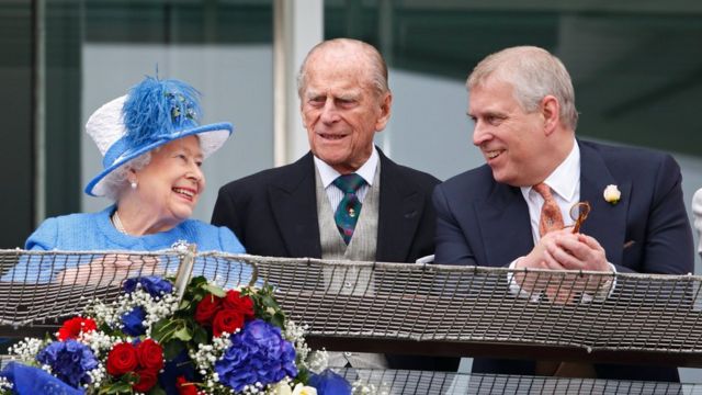 The Queen, the Duke of Edinburgh and Prince Andrew watch the racing from the balcony of the Royal Box as they attend Derby Day at Epsom Racecourse in 2016