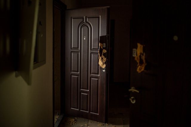 Every door in Vitaliy Brezhnev's apartment building had been blown open with a shotgun.