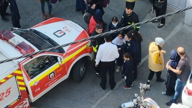 Emergency services attend cases of poisoning at a primary school in eastern Tehran.