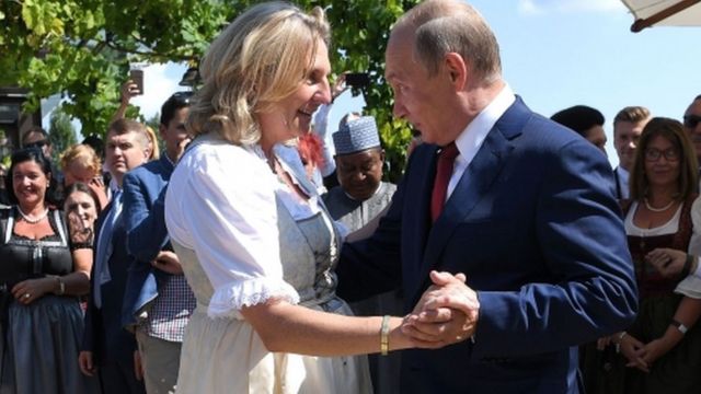 Austrian Foreign Minister Karin Kneissl and Russian President Vladimir Putin dance during her wedding on 18 August 2018 in Gamlitz, Austria