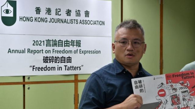Chairperson of the Hong Kong Journalists Association (HKJA) Ronson Chan (L) and Chris Yeung, chief editor of the annual report, pose during a press conference for the release of the organisations annual report Freedom in Tatters in Hong Kong on July 15, 2021.