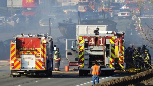 Firefighters are involved in controlling a fire caused by a traffic accident in Colorado