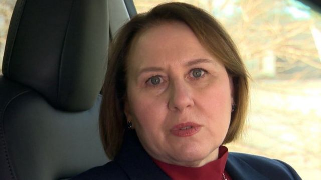 Anne Marie Squeo, a white woman with blue eyes, inside a car