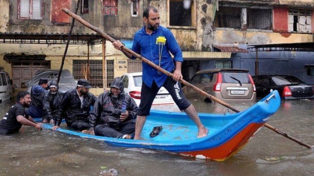 Rescue operation by boat is going on in the streets of the city