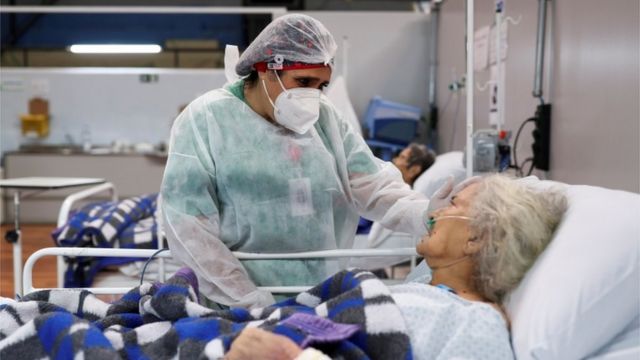 A nurse talks to a COVID-19 patient in Santo Andre, Sao Paulo, Brazil on January 1, 2021.