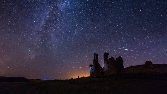 Perseid meteor over Dunstanburgh Castle with the Milky Way also in shot