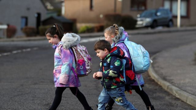 Pupils walk to Pitlochry High School on the first day back following the easing of the coronavirus disease (COVID-19) restrictions